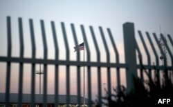 FILE - The American flag is pictured outside the Paso del Norte Port of Entry in El Paso, Texas, April 7, 2018.