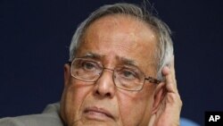Indian Finance Minister Pranab Mukherjee listens to a question during a press conference in New Delhi, India, 25 Jan 2011