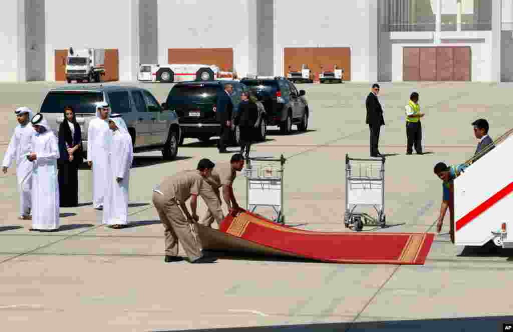 The red carpet is rolled up after U.S. Secretary of State John Kerry boarded his plane to leave Abu Dhabi, United Arab Emirates on his way to the final destination of Qatar, March 5, 2013.