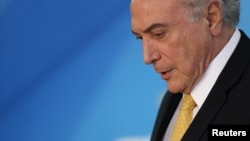 Brazil's President Michel Temer attends a meeting with trade unionists at the Planalto Palace in Brasilia, Brazil, Sept. 12, 2017.