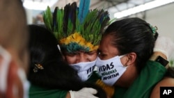 Relatives cry during the funeral of Kokama Chief Messias Martins Moreira, who died of COVID-19, during his burial service at the Park of Indigenous Nations in Manaus, Brazil, May 14, 2020.