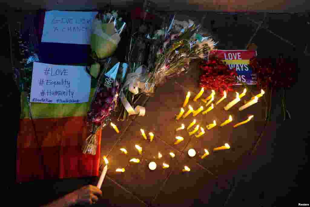 Candlelight vigil in solidarity with victims of Pulse Orlando shooting, U.S. Embassy in Bangkok, Thailand, June 13, 2016.