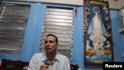 FILE - Cuban dissident Jose Daniel Ferrer gives an interview to Reuters inside his home in Palmarito de Cauto, March 25, 2012. 