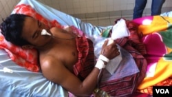 So Nang, 27, a Cambodian garment worker, receives treatment at Preah Kosamak hospital in Phnom Penh, January 6, 2014.
