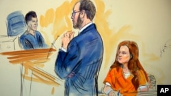 This courtroom sketch depicts Maria Butina, a 29-year-old gun-rights activist suspected of being a covert Russian agent, listening to Assistant U.S. Attorney Erik Kenerson as he speaks to Judge Deborah Robinson, left.