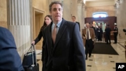 FILE - Michael Cohen, President Donald Trump's former lawyer, returns to Capitol Hill for a fourth day of testimony as Democrats pursue a flurry of investigations into Trump's White House, businesses and presidential campaign, in Washington, March 6, 2019.