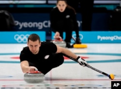 FILE - Russian curler Alexander Krushelnitsky practices ahead of the 2018 Winter Olympics in Gangneung, South Korea, Feb. 7, 2018.