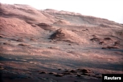 FILE - The base of Mars' Mount Sharp is pictured in this August 27, 2012 NASA handout photo taken by the Curiosity rover.