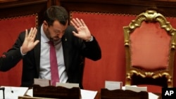 FILE - Italian Deputy Premier Matteo Salvini gestures as he addresses the Senate in Rome, July 11, 2019.