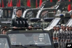 Chinese President Xi Jinping inspects Chinese troops of People's Liberation Army (PLA) Hong Kong Garrison at the Shek Kong Barracks in Hong Kong, June 30, 2017.