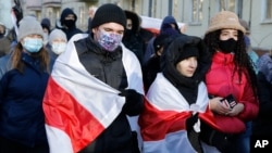  Young demonstrators are seen during an opposition rally to protest the official presidential election results in Minsk, Belarus, Dec. 6, 2020. 