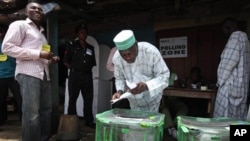 A man cast his vote during the National Assembly election at a polling station in Ibadan, Nigeria, April 9, 2011