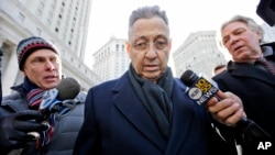 Former New York State Assembly Speaker Sheldon Silver, center, is surrounded by members of the media as he leaves a federal courthouse in New York, Feb. 24, 2015.