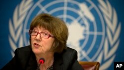 Yemenis look down through a hole in the roof of a house which was damaged the day before during an air strike by Saudi-led coalition warplanes on the nearby base on Fajj Attan hill in the capital Sana'a.<br />
&nbsp;
