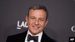 FILE - Disney CEO Bob Iger, pictured in October 2016 at a Los Angeles gala, has served in an advisory role for President Barack Obama and will do the same for Donald Trump when he assumes the presidency. 