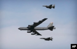 A U.S. Air Force B-52 bomber flies over Osan Air Base in Pyeongtaek, South Korea, Jan. 10, 2016.