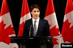 FILE - Canadian Prime Minister Justin Trudeau speaks during a news conference in Davos, Switzerland, Jan. 22, 2016.
