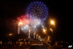 Fireworks explode during an election rally by Ivory Coast incumbent President Alassane Ouattara in Abidjan, Oct. 23, 2015.