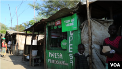 A solar-powered charging station for mobile phones at Kakuma. (M. Yusuf/VOA)