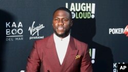 FILE - Kevin Hart poses at Kevin Hart's "Laugh Out Loud" new streaming video network launch event at the Goldstein Residence in Beverly Hills, California, Aug. 3, 2017. Hart pledged $25,000 to Hurricane Harvey relief efforts Sunday, Aug. 27, 2017, and called on fellow celebrities to do the same. 