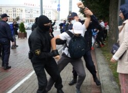 A student is detained by law enforcement officers during a protest against presidential election results in Minsk, Belarus, Sept. 1, 2020.