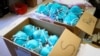 FILE - Boxes of N95 protective masks for use by medical field personnel are seen at a New York State emergency operations incident command center during the coronavirus outbreak in New Rochelle, New York, March 17, 2020.