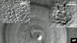 This undated image taken by the NASA Mars Reconnaissance Orbiter released by NASA/JPL-Caltech/University of Rome/Southwest Research Institute shows a recently discovered underground deposit of carbon dioxide ice in the Martian south pole