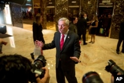 Iowa Gov. Terry Branstad speaks to members of the media in the lobby of Trump Tower in New York, Dec. 6, 2016.