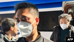 This photo taken and released by Taiwan’s Central News Agency on Feb. 20, 2024 shows relatives of the Chinese victims, who died after their boat capsized near the Taipei-administered Kinmen island, arriving in Kinmen.