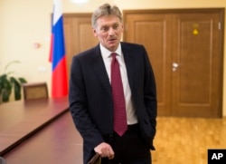 FILE - President Vladimir Putin’s spokesman Dmitry Peskov speaks to a reporter in Moscow.