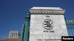 FILE - Signage is seen at the headquarters of the World Trade Organization (WTO) in Geneva, Switzerland, June 2, 2020. 