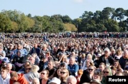 People attend the national remembrance service for victims of the mosque attacks, at Hagley Park in Christchurch, New Zealand, March 29, 2019.