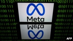 FILE - This picture taken on Jan. 12, 2023, in Toulouse, France, shows a tablet displaying the logo of the company Meta. The company is reportedly planning to offer European users subscription-based versions of Instagram and Facebook.