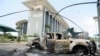 Burnt out cars are seen outside a government building, following an election protest in Libreville, Gabon, Sept. 1, 2016.