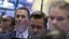 Traders work on the floor of the New York Stock Exchange in lower Manhattan, April 20, 2016.