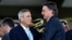 FILE - Brazilian President Jair Bolsonaro, right, greets his vice presidential candidate, Walter Souza Braga Netto during the celebration of Soldier's Day at the Army headquarters in Brasilia on Aug. 25, 2022.
