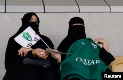 Saudi women watch the soccer match at King Abdullah Sports City in Jeddah, Saudi Arabia, Jan. 12, 2018.