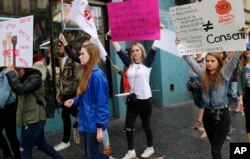 Participants take a stand against sexual assault and harassment for the #MeToo March in the Hollywood district of Los Angeles on Nov. 12, 2017.