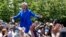 Hillary Clinton greets supporters upon her arrival for a speech at Roosevelt Island in New York at the first major rally of her 2016 campaign for the presidency, June 13, 2015.