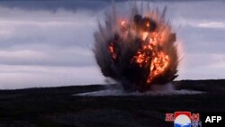 This picture taken on September 18, 2024 and released from North Korea's official Korean Central News Agency (KCNA) via KNS on September 19, 2024 shows a new tactical ballistic missile landing on the target during a test-firing, at an undisclosed location