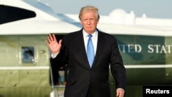 U.S. President Donald Trump waves before his departs from Newark Liberty International airport after a weekend at Trump National Golf Club in Bedminster, New Jersey, June 11, 2017. 