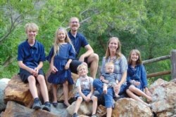 Jacob Harlan of China Horizons is seen with his family, including his daughter, Viara, 8, who had been detained with him in China and was later released, in this undated photo from the family's GoFundMe page.