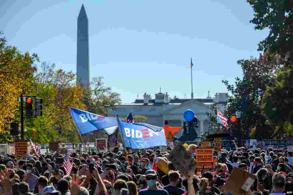 People celebrate on Black Lives Matter plaza across from the White House in Washington, Nov. 7, 2020, after Democrat Joe Biden was projected the winner of the 2020 presidential election.