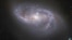 FILE - Looking deep into the Universe, the NASA/ESA Hubble Space Telescope catches a passing glimpse of the numerous arm-like structures that sweep around this barred spiral galaxy, known as NGC 2608. 