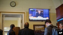 Presiding officer Chief Justice of the United States John Roberts reads a question during the impeachment trial against President Donald Trump in the Senate at the U.S. Capitol in Washington, Jan. 29, 2020.