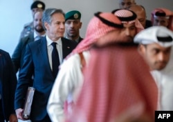 U.S. Secretary of State Antony Blinken walks with representatives from Egypt, Jordan, Saudi Arabia, Qatar, the United Arab Emirates and the Palestinian Authority at the Four Seasons Hotel in Riyadh, Saudi Arabia, on April 29, 2024.