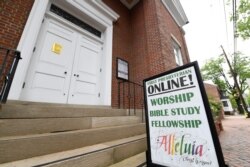 The sign for First Presbyterian Church of Annapolis, Md., displays information for online services, May 22, 2020.