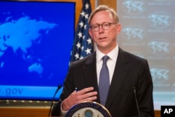FILE - Brian Hook, special representative for Iran, speaks about the creation of the Iran Action Group at the State Department, in Washington, Aug. 16, 2018.