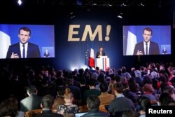 FILE - Emmanuel Macron, head of the political movement En Marche !, or Onwards !, and candidate for the 2017 French presidential election, speaks during a Paris news conference to unveil his budget manifesto, March 2, 2017.