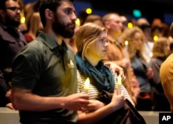 People gather to pray for the victims of the mass shooting during a candlelight vigil in Thousand Oaks , Calif., Nov. 8, 2018.